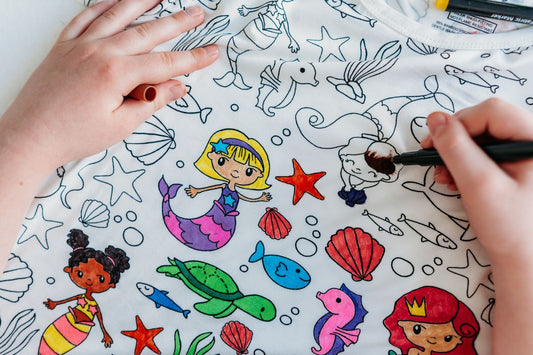 Child coloring Bee Colorful Co. Mermaid Coloring Pajamas as a screen-free summer activity