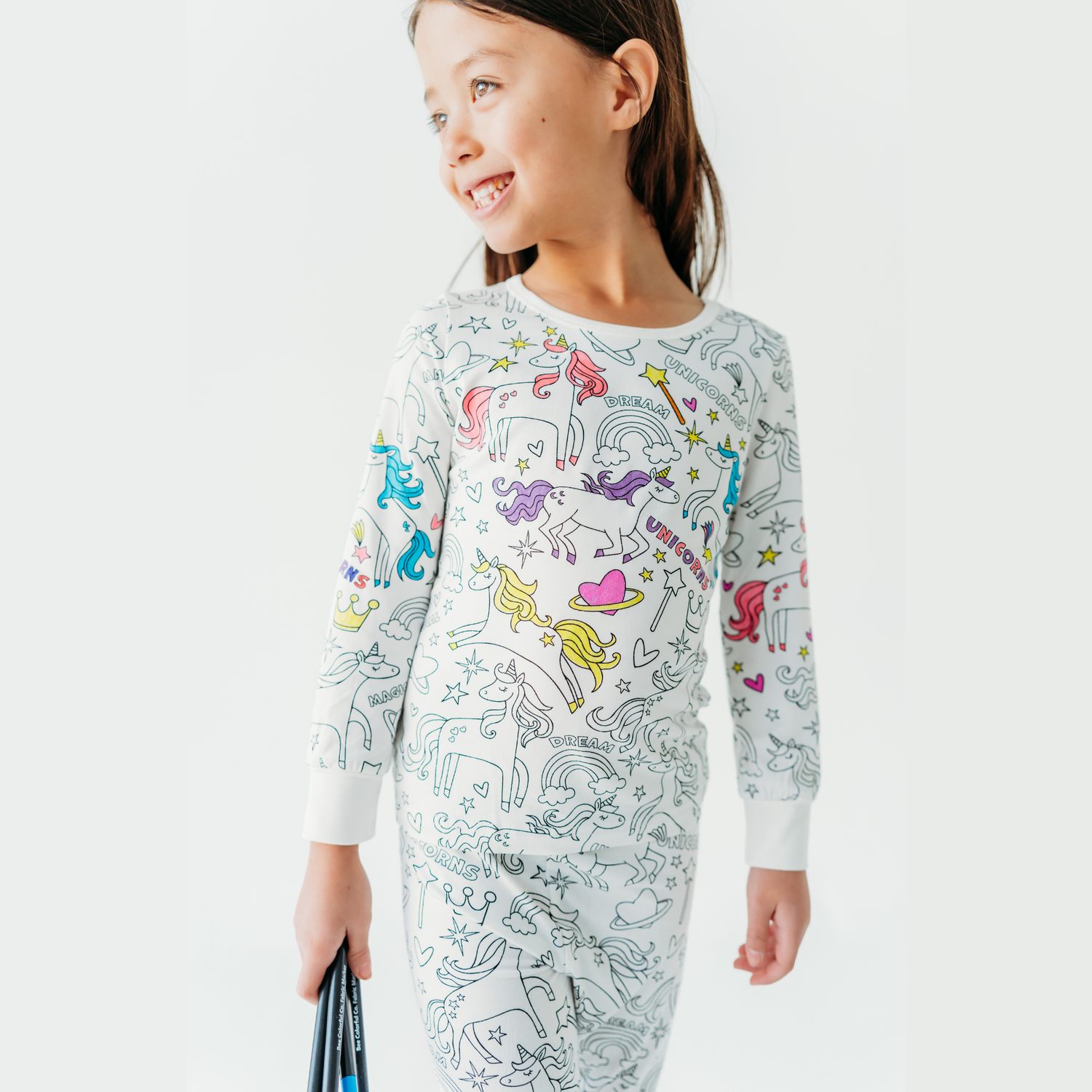 Kids wearing bamboo coloring pajamas with unicorn design