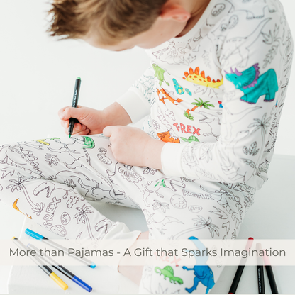 Kid coloring dinosaur bamboo pajamas with fabric markers