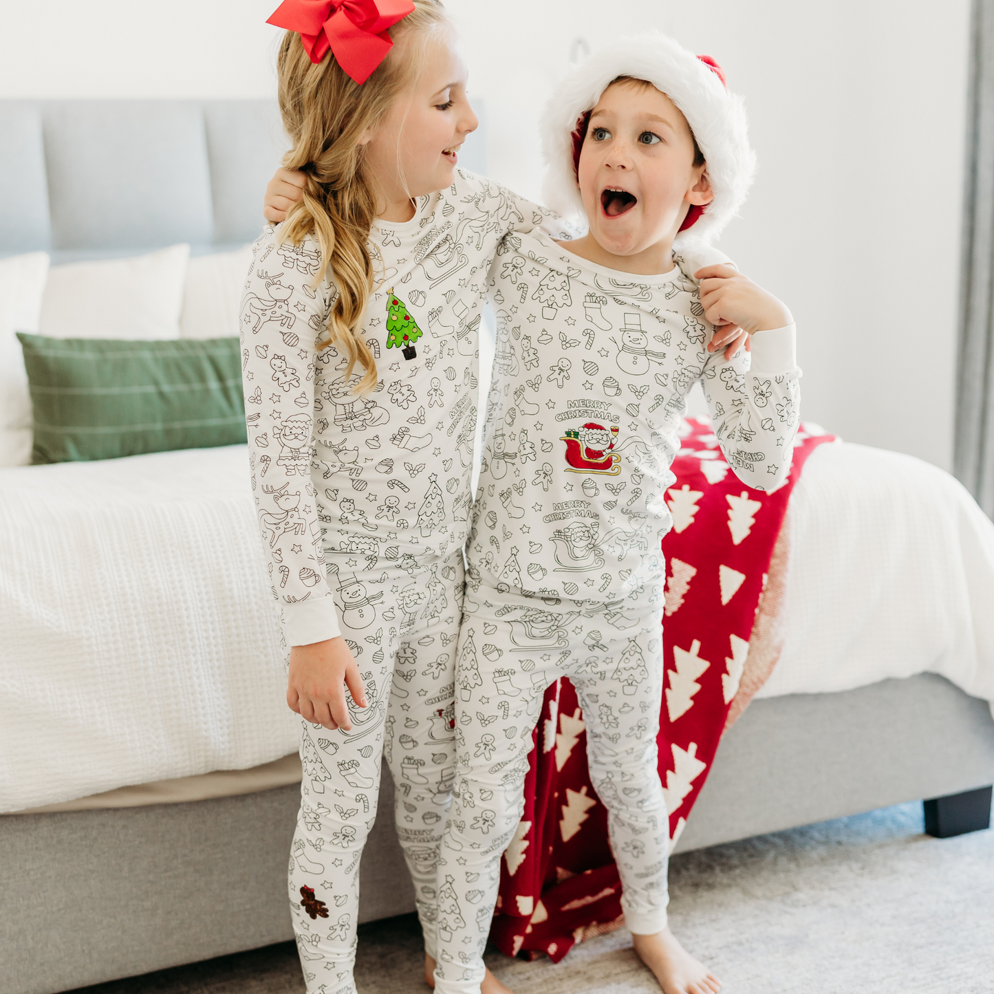 Siblings in Christmas coloring pajamas for kids